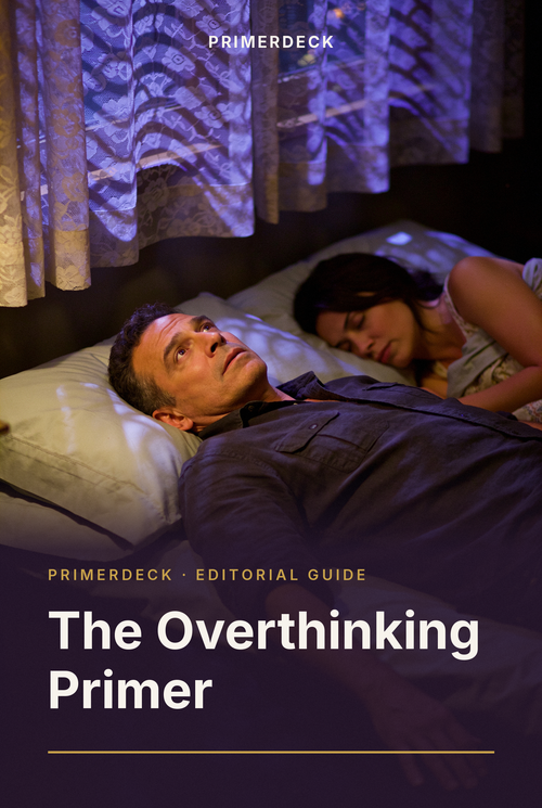 PrimerDeck cover: The Overthinking Primer: man lies awake at night while his partner sleeps, violet light through lace curtains